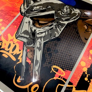 May include: A black and white illustration of a person wearing a silver helmet with a black and white background. The helmet has a face mask with a grill design. The background has a black and white pattern and the word "DOOM" in orange.