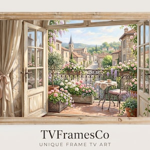 Puede incluir: Una impresión enmarcada de un balcón con vistas a un pueblo europeo. La imagen presenta puertas abiertas, un balcón de hierro forjado con flores, una mesa y una silla. La escena está pintada en colores suaves, con el texto "TVFramesCo UNIQUE FRAME TV ART" en la parte inferior.