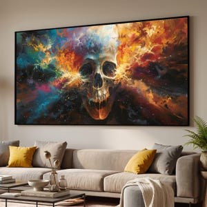 May include: A large framed canvas art print featuring a skull with an explosion of colorful, swirling energy. The artwork uses a palette of blues, oranges, yellows, and purples, creating a dramatic and eye-catching visual.