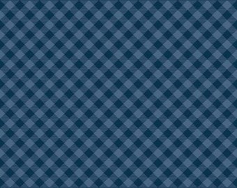 May include: A fabric swatch featuring a repeating diagonal plaid pattern in shades of dark navy blue and medium slate blue. A white ruler measuring 12 inches is visible at the bottom edge with the text Riley Blake Designs.