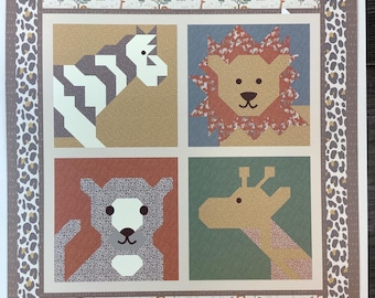 May include: A square quilt featuring four panels with geometric animal illustrations: a zebra, a lion, a leopard, and a giraffe. The border displays a leopard print pattern and horizontal strips with small animal motifs and the text "soft furry friend sweet dreams snuggle a little one furry cuddles".