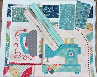 May include: Two nylon zippers in beige and light blue are placed diagonally over a printed fabric panel featuring illustrations of a sewing machine, an iron, and various sewing-themed patterns in shades of blue, red, green, and yellow.