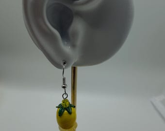 A tiny citrine crystal on top of a lemon shaped bead, yellow in colour earrings with surgical steel ear wire