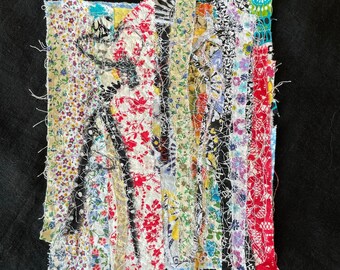 May include: A colorful patchwork of fabric strips sewn together in a vertical pattern. The fabric is a mix of floral prints, stripes, and solid colors.