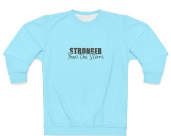 Sudadera unisex "Más fuerte que la tormenta"
