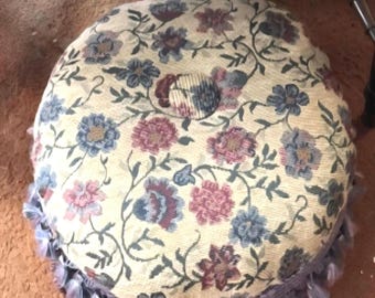 Vintage Footstool, Ottoman, or Pouf, featuring a decorative floral tapestry and dense tassel border