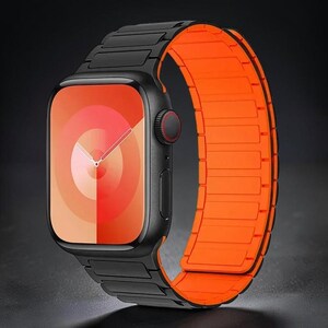 May include: Black smartwatch with an orange magnetic band. The watch face displays a gradient of red and orange hues. The watch has a black bezel and a red button. The band is made of rectangular segments.