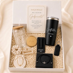 May include: A white gift box containing a card asking to be godparents, a glass tumbler with a bamboo lid and straw, a black tumbler, a gold compact mirror, a black comb, a keychain, a scrunchie, a hair clip, a bracelet in a pouch, and a cross bracelet.
