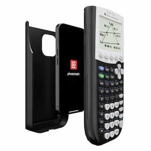 May include: A black smartphone with the Photomath logo is next to a black calculator and a black phone case. The calculator has a white top with a screen displaying a math problem and a black keypad with white keys.