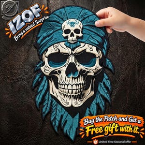 May include: An embroidered patch featuring a skull wearing a teal feathered headdress and a matching headband with a smaller skull emblem. The design includes intricate black and white line work on the skull, set against a dark background.