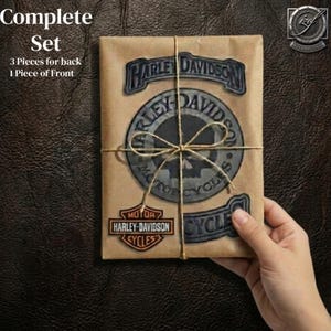 May include: A brown paper-wrapped package featuring Harley-Davidson logos and text. The package is tied with twine and includes the words "Complete Set" and "3 Pieces for back 1 Piece of Front".