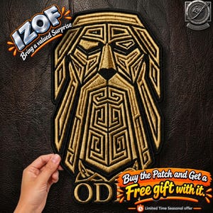 May include: A gold and black embroidered patch featuring a stylised geometric face with a long beard and hair. The design includes intricate angular lines and patterns. The text "IZOF" appears in the top left corner, and "OD" is visible at the bottom.
