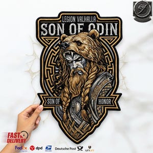 May include: A shield-shaped embroidered patch featuring a central illustration of a bearded warrior wearing a bear pelt headdress. The text reads LEGION VALHALLA, SON OF ODIN, and SON OF HONOR in white lettering against a black and gold background.