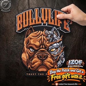 May include: A black embroidered patch featuring a brown bulldog head with a robotic mechanical half. The text BULLYLIFE is arched in orange above the dog, and the words TRUST THE PROCESS are printed in small white letters at the bottom edge.