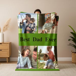 May include: A green blanket with four photo collages of a father and child. The blanket has the text "Best Dad Ever" in large, black letters across the centre. The photos show a father and child in various outdoor settings.