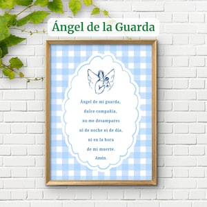 May include: A framed wall print featuring a light blue and white gingham background. A central white scalloped oval contains a dark blue line drawing of an angel and the Spanish text: Ángel de mi guarda, dulce compañía, no me desampares ni de noche ni de día, ni en la hora de mi muerte. Amén.