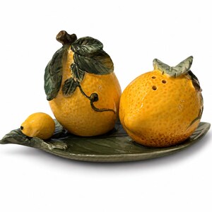 Lemon Collection, Corner Ruby, Lemon ceramic salt and pepper on green leaf. RARE