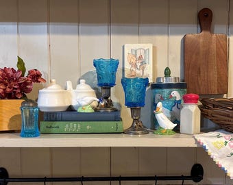 Curated Decor grouping of vintage cottage decor including vintage glass items and goose decor