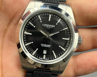 Reloj de pulsera LONGINES CONQUEST para hombre, reacondicionado, con esfera negra, indicador de fecha y movimiento automático.