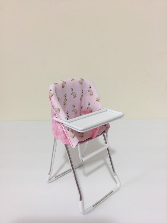 pink and grey high chair