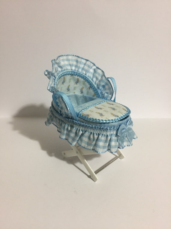 blue moses basket and stand