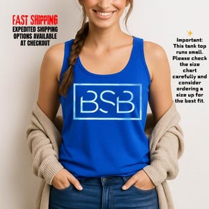 May include: A royal blue tank top with the letters "BSB" in a white, glowing font inside a white rectangle. The text "Important: This tank top runs small. Please check the size chart carefully and consider ordering a size up for the best fit." is also visible.