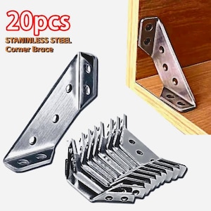 May include: A collection of stainless steel corner braces. The image shows multiple silver-colored, right-angle brackets with pre-drilled holes for screws. The text "20pcs STAINLESS STEEL Corner Brace" is visible in the upper left corner.
