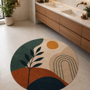 May include: A circular rug with an abstract design. It features a dark green section, a rust-coloured section, and a navy blue section. The rug has a beige background with a yellow sun and a green arched design. A black plant silhouette is in the centre.