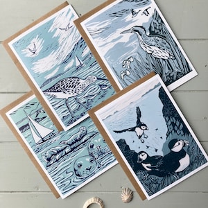 4 cartes côtières, linogravure, faune, oiseau, vierge, cartes de voeux, macareux, courlis, butor, phoques, paquet de cartes, mer, bord de mer, rivage, oiseaux de rivage, cartes d'art