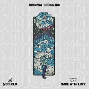 May include: Embroidered patch featuring an astronaut gazing at a celestial scene with a large planet and mountains. The patch has a rectangular shape with the text "ORIGINAL DESIGN INC", "@odi.clo", and "MADE WITH LOVE". The color palette includes blue, white, and black.