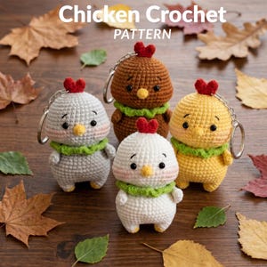 May include: Four crocheted chicken keychains in gray, brown, white, and yellow, each featuring a red heart-shaped comb, a yellow beak, black eyes, and a green collar. The text Chicken Crochet PATTERN is displayed above the figures.