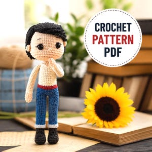 May include: A crocheted doll with black hair, blue jeans, and a cream-colored top. The doll is posed with a finger on its chin. A sunflower and the text "CROCHET PATTERN PDF" are also in the image.