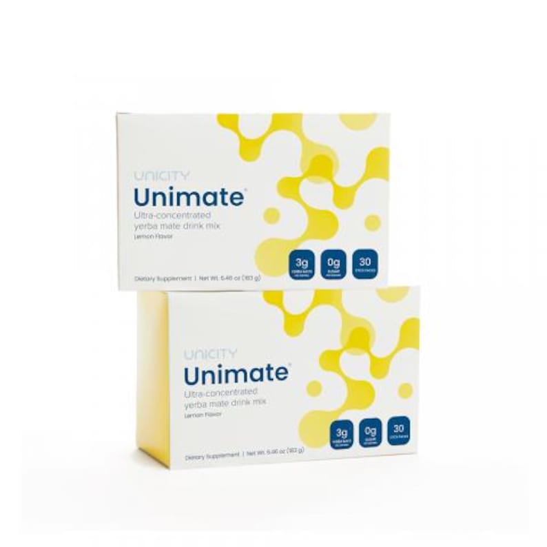 May include: Two boxes of Unicity Unimate yerba mate drink mix. The boxes are white with yellow abstract designs and the text "Unimate" in blue. Each box contains 30 packets and is lemon flavoured.