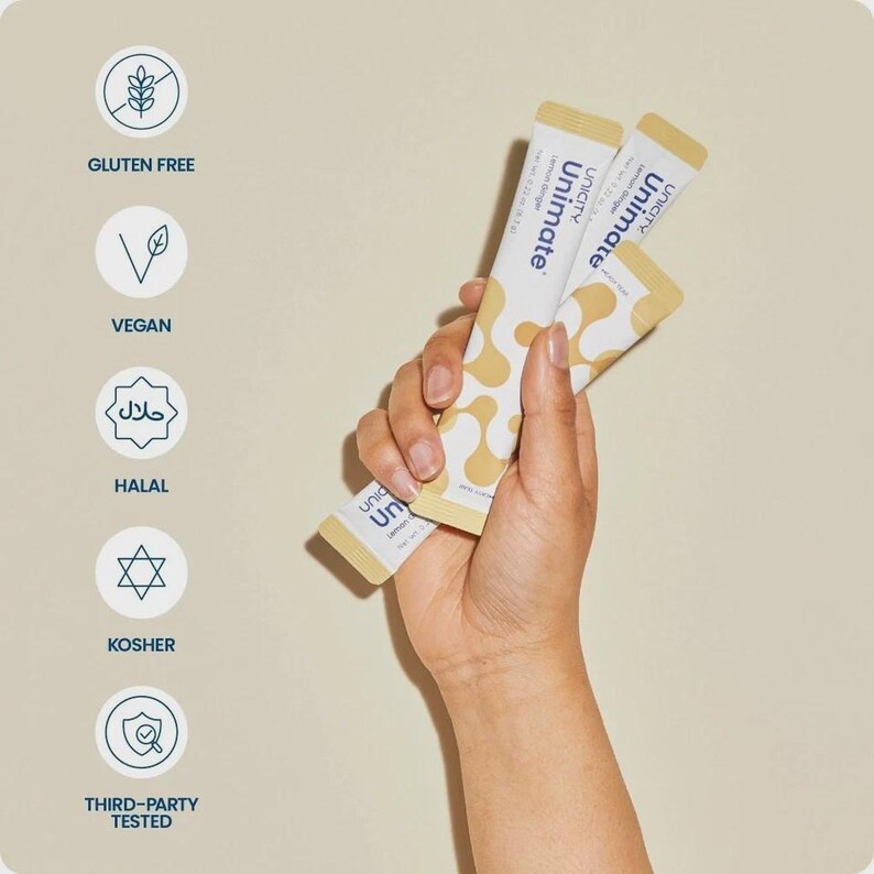 May include: A hand holds three Unimate Lemon Ginger sachets. The packets are white with yellow patterns and text. The image also features icons indicating Gluten Free, Vegan, Halal, Kosher, and Third-Party Tested certification.