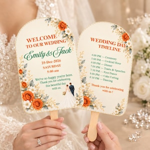 May include: Two arched wedding fans with wooden handles featuring orange roses, white flowers, and greenery. One fan displays "Welcome to our wedding," names "Emily & Jack," date, and time. The other lists a "Wedding day timeline" from 4:00 PM to 8:30 PM.