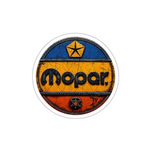 May include: A round sticker featuring the Mopar logo. The logo is in a distressed style with a yellow and orange background, blue top, and red bottom. The word "Mopar" is in black, and a star is at the top.