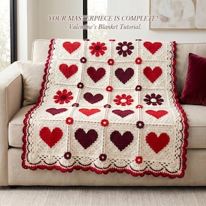 May include: A cream-colored crochet blanket featuring a grid of red and dark maroon hearts and flowers. The text reads: YOUR MASTERPIECE IS COMPLETE! - Valentine's Blanket Tutorial. The blanket has a scalloped red and maroon border.