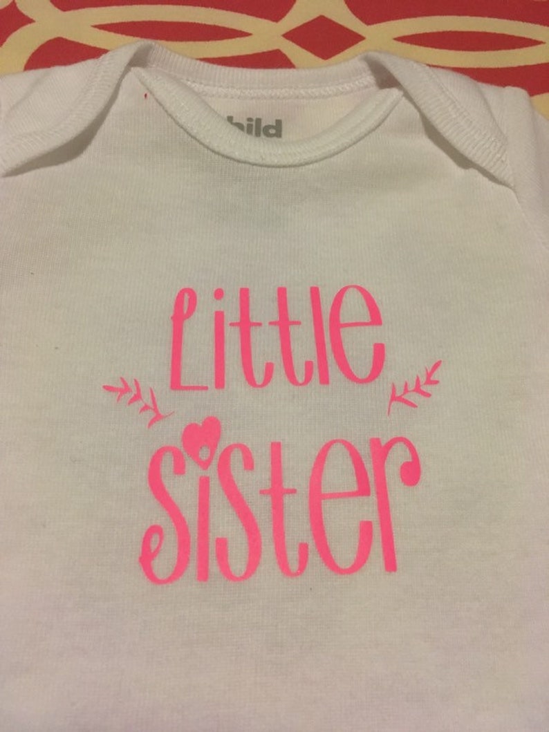 Pink Little Sister design on white Onesie for newborn baby