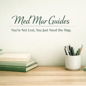 May include: A desk scene with the text "Med Mar Guides" and "You're Not Lost, You Just Need the Map." Includes a small potted plant, stacked books, a pen holder with pens, and a stack of sticky notes.
