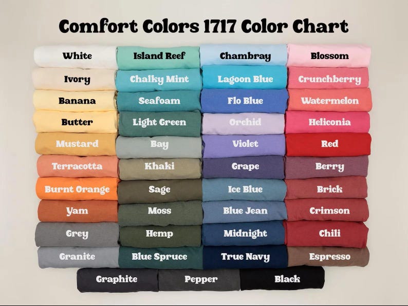 May include: A color chart titled "Comfort Colors 1717 Color Chart" displays a variety of fabric colors. The chart includes shades like white, ivory, banana, butter, mustard, terracotta, burnt orange, yam, grey, and granite.
