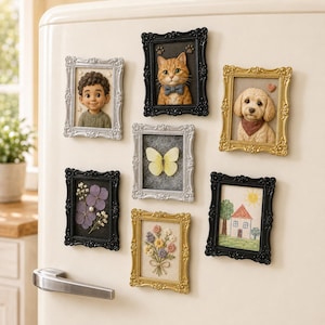May include: A collection of seven rectangular picture frame magnets featuring various designs including a sculpted child, a cat with a bow tie, a dog with a bandana, a yellow butterfly, pressed purple flowers, a floral bouquet, and a child's house drawing.