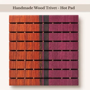 May include: A square wooden trivet hot pad featuring horizontal slats with a visible wood grain. The design consists of a vibrant orange section on the left, a thin dark brown vertical stripe in the center, and a deep purple section on the right.