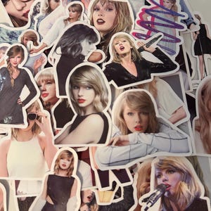 May include: A collection of die-cut vinyl stickers featuring various photographic portraits and performance images of Taylor Swift. The stickers display diverse outfits, hairstyles, and expressions, including close-ups and full-body shots of the singer.