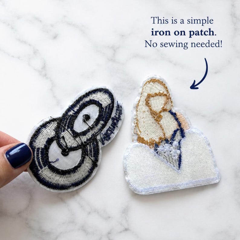 May include: Two embroidered iron-on patches. One patch features a black and white circular design, while the other depicts a figure in gold and white. Text on the image reads: This is a simple iron on patch. No sewing needed!