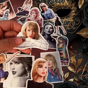 May include: A collection of die-cut vinyl stickers featuring various photographic portraits and full-body images of Taylor Swift in different outfits, hairstyles, and poses, including black and white and full-color prints with white borders.