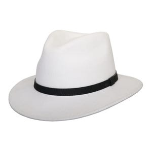 May include: A white fedora hat with a black band. The hat features a classic teardrop crown and a wide brim. The black band encircles the crown, providing a contrast to the hat's design. This hat is a stylish accessory.