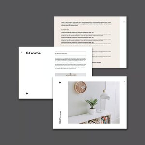 May include: A collection of documents and a photograph. The documents include text and the word "STUDIO." The photograph shows a white shelf with a plant, books, a lamp, and a clock. The background is a light gray.
