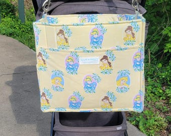 Large Park Bag featuring stroller straps, adjustable shoulder strap,  plenty of pockets! In Princess print!