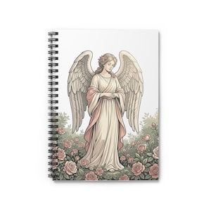 May include: Spiral-bound notebook featuring an illustration of an angel with large wings, wearing a white and pink gown, standing in a rose garden. The angel has a serene expression. The notebook's cover is white.