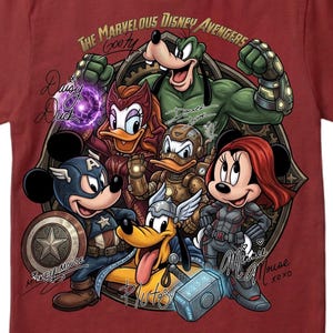 May include: Maroon t-shirt featuring a graphic of Disney characters as Avengers. The design includes Mickey Mouse as Captain America, Minnie Mouse as Black Widow, and Goofy as the Hulk, with text that reads "The Marvelous Disney Avengers".